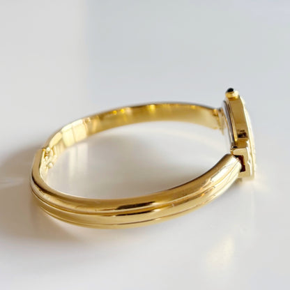 Yves Saint Laurent 1990s Black Round Dial Gold Plated Bangle Watch