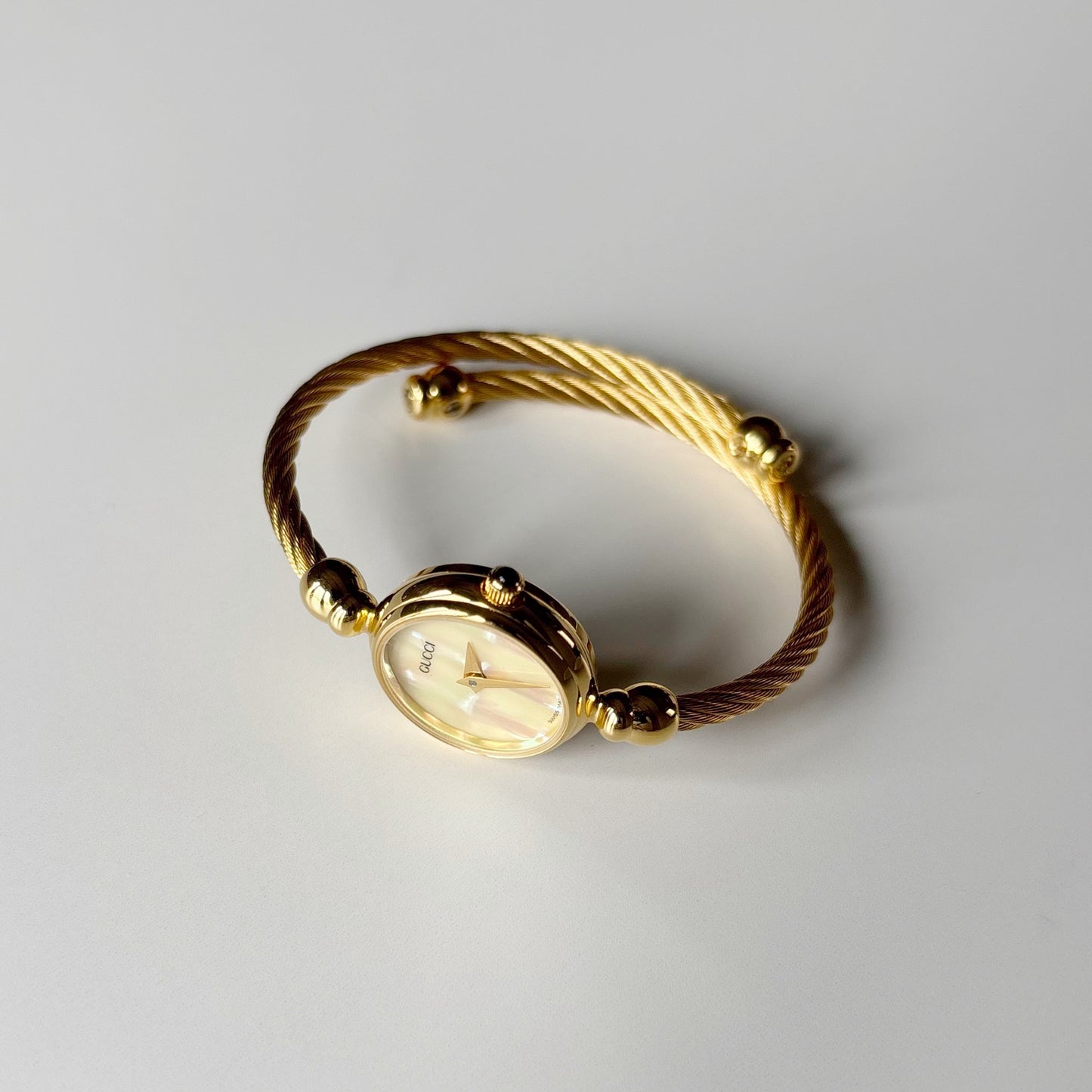 Gucci 1990s Seashell Dial Gold Plated Cable Bangle Watch
