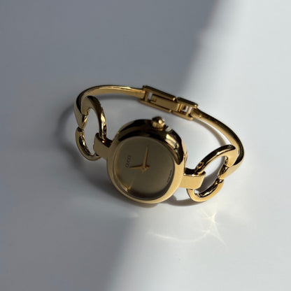 Gucci 1990s Oval Gold Dial Gold Plated Bangle Watch (Small)