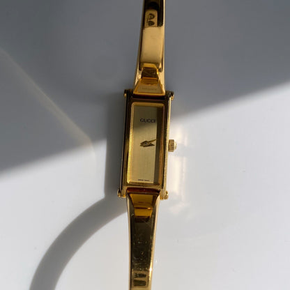 Gucci 1990s Gold Dial Rectangular  Gold Plated Bangle Watch