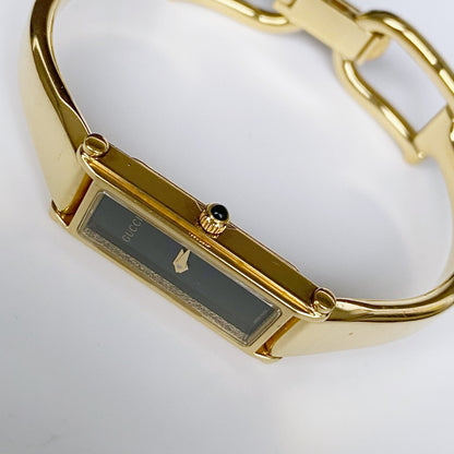 Gucci 1990s Black Dial Rectangular Gold Plated Bangle Watch