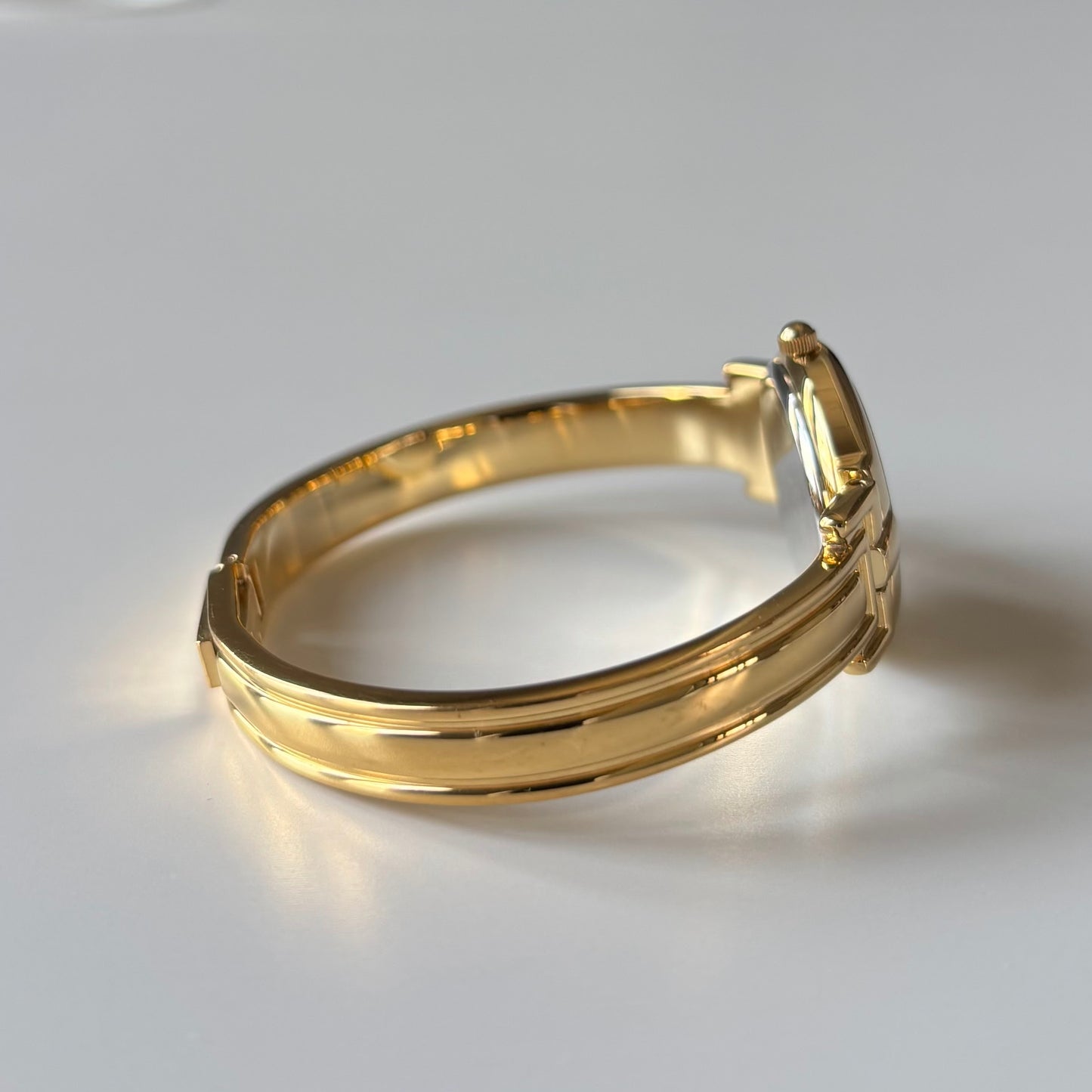 Givenchy 1990s Black Round Dial Gold Plated Bangle Watch