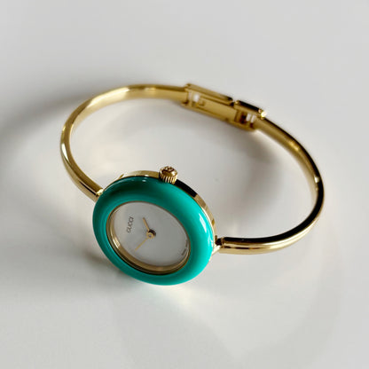 Gucci 1990s Interchangeable Bezel Gold Plated Bangle Watch with 12 bezels, case