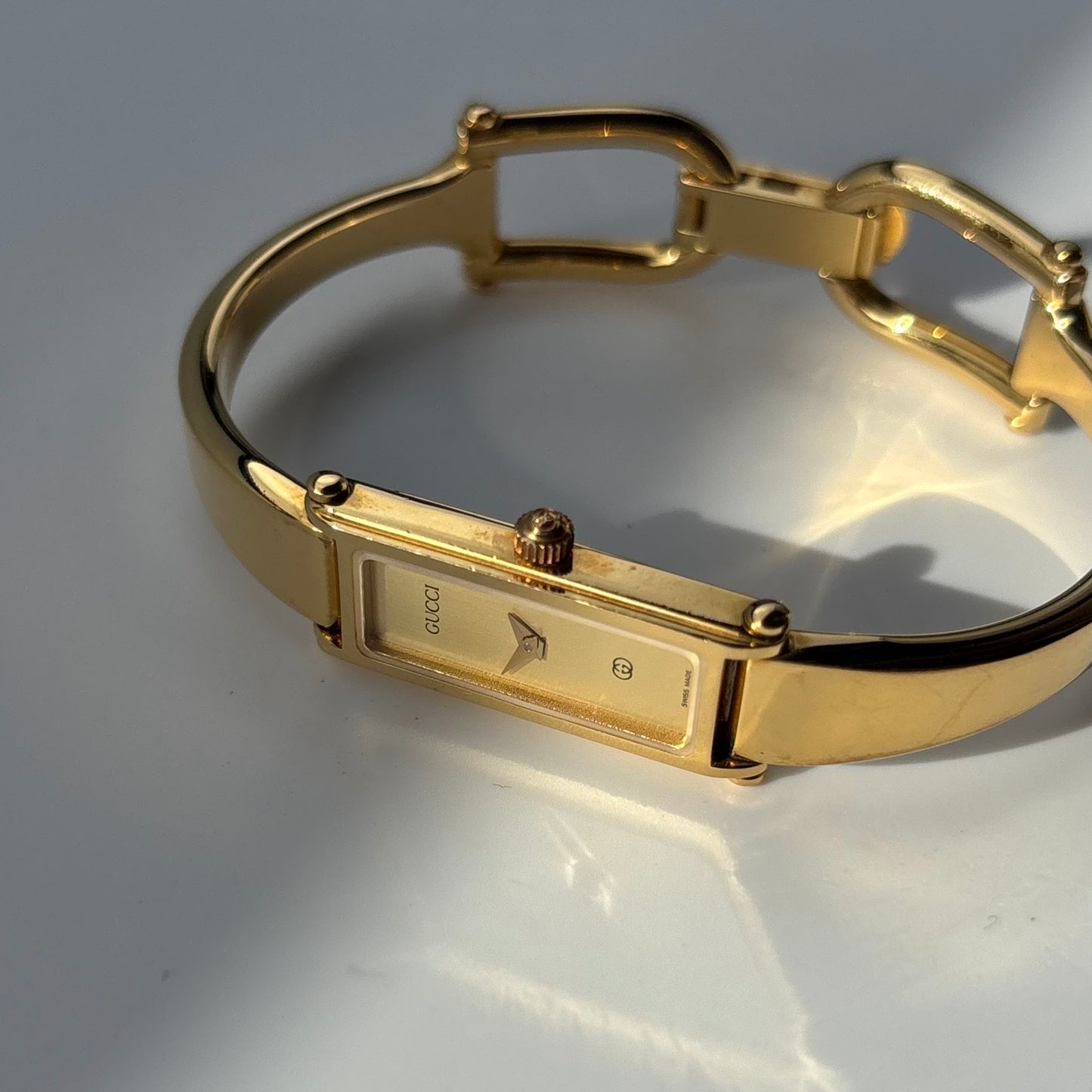 Gucci 1990s Gold Rectangular Dial Gold Plated Bangle Watch