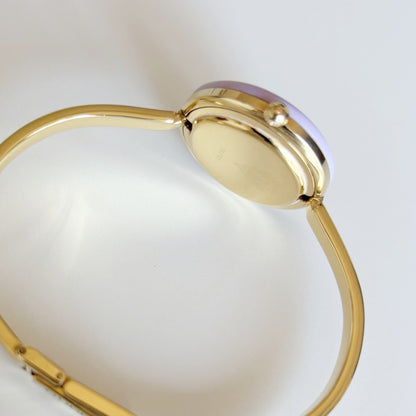 Gucci 1990s Interchangeable Bezel Gold Plated Bangle Watch with 12 bezels, case