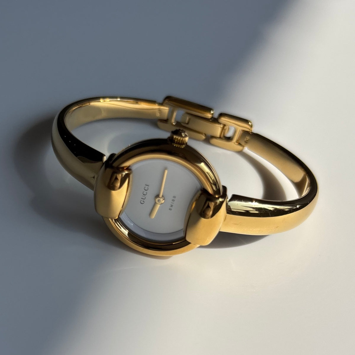 Gucci Round Dial Gold-Plated Bangle Watch