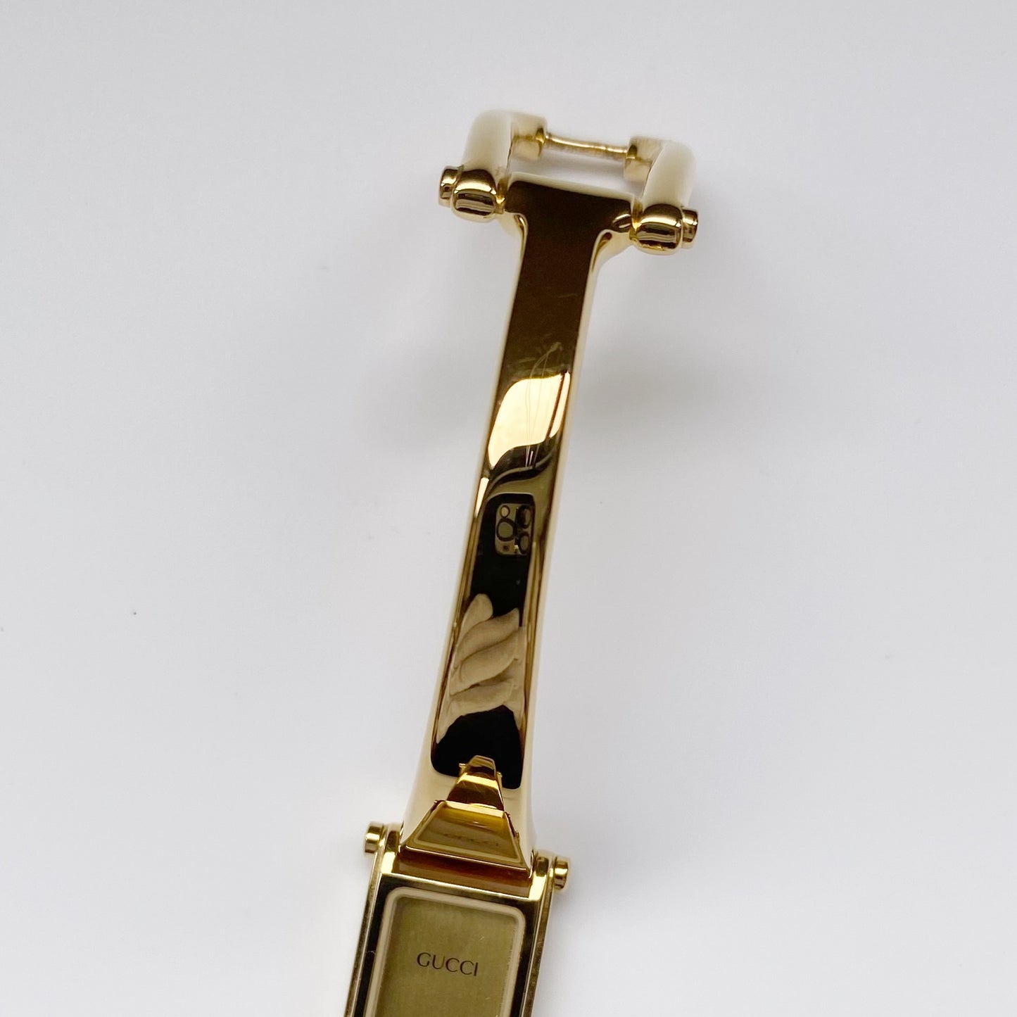 Gucci 1990s Gold Dial Gold Plated Rectangular Bangle Watch