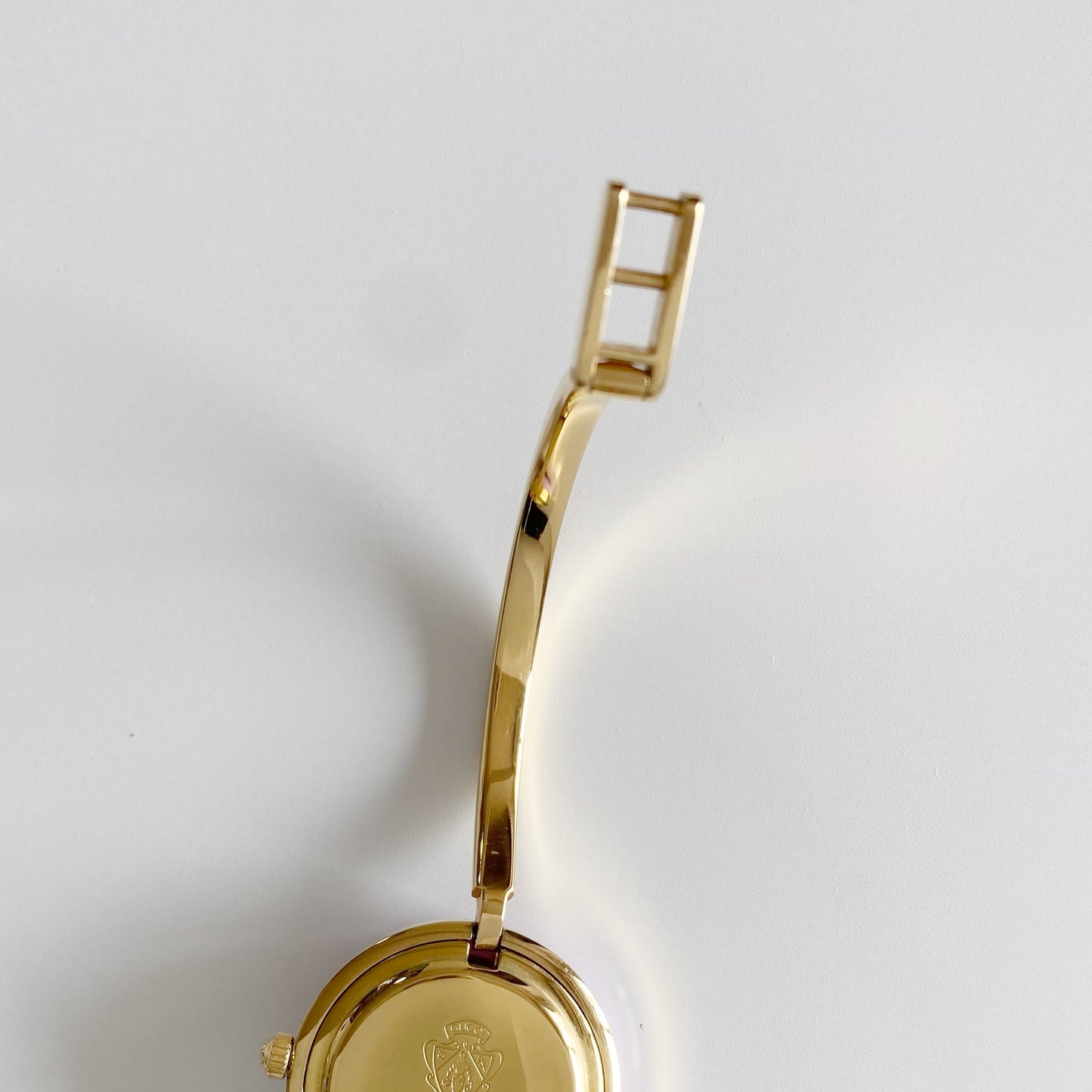 Gucci 1990s Interchangeable Bezel Gold Plated Bangle Watch with 12 bezels, case