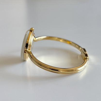 Gucci 1980s Interchangeable Bezel Gold Plated Bangle Watch with 12 bezels, case