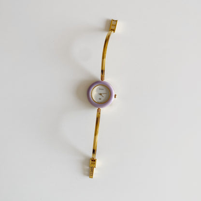 Gucci 1990s Interchangeable Bezel Gold Plated Bangle Watch with 12 bezels, case