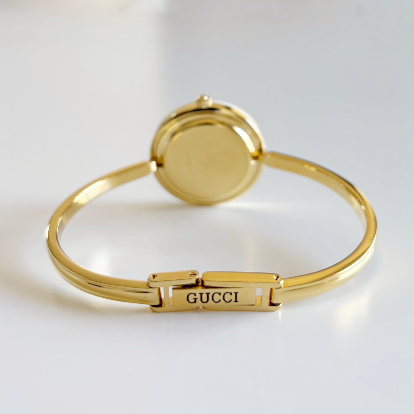 Gucci 1990s Interchangeable Bezel Gold Plated Bangle Watch with 12 bezels, case