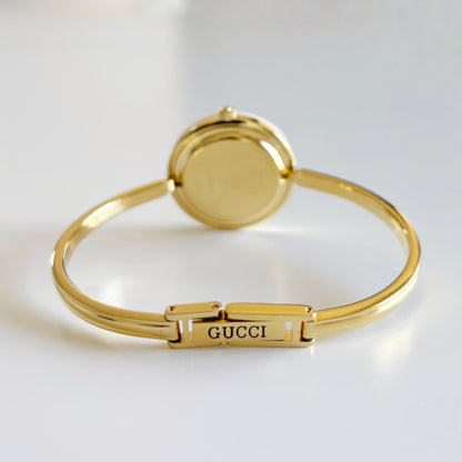 Gucci 1990s Interchangeable Bezel Gold Plated Bangle Watch with 12 bezels, case