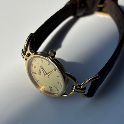 Gucci 1990s Gold Round Dial Horsebit Gold Plated Watch