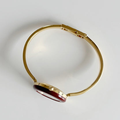 Gucci 1990s Interchangeable Bezel Gold Plated Bangle Watch with 12 bezels, case