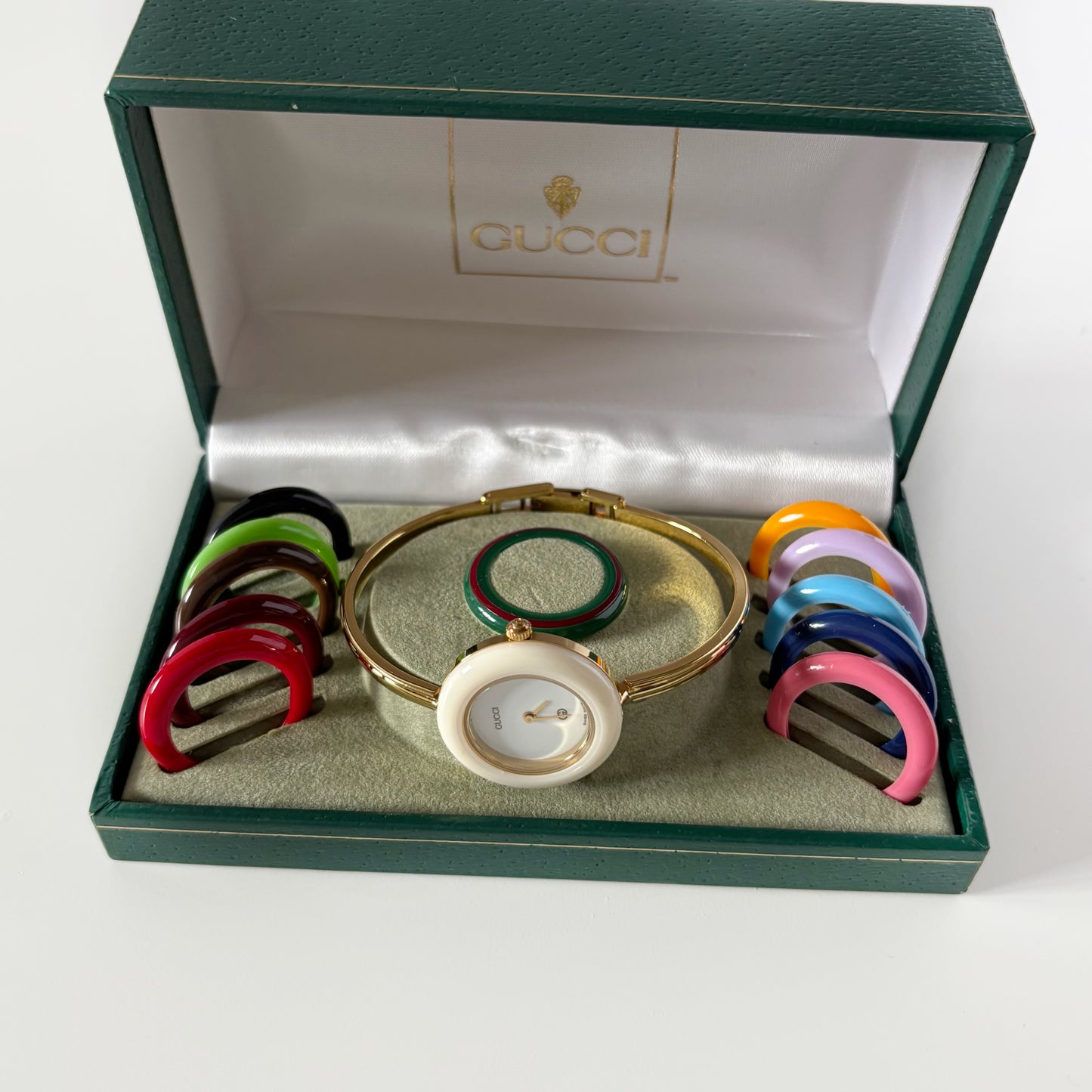 Gucci 1990s Interchangeable Bezel Gold Plated Bangle Watch with 12 bezels, case