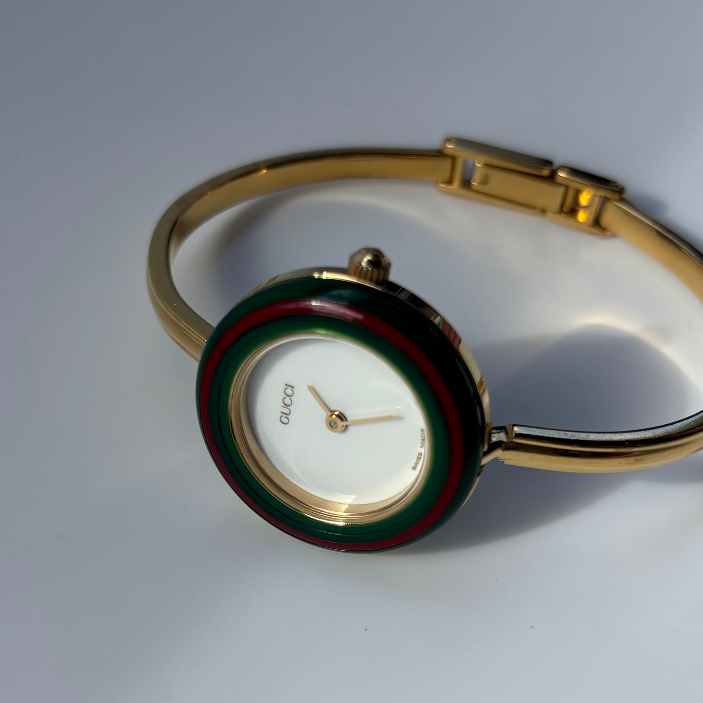 Gucci 1990s Interchangeable Bezel Gold Plated Bangle Watch with 12 bezels, case