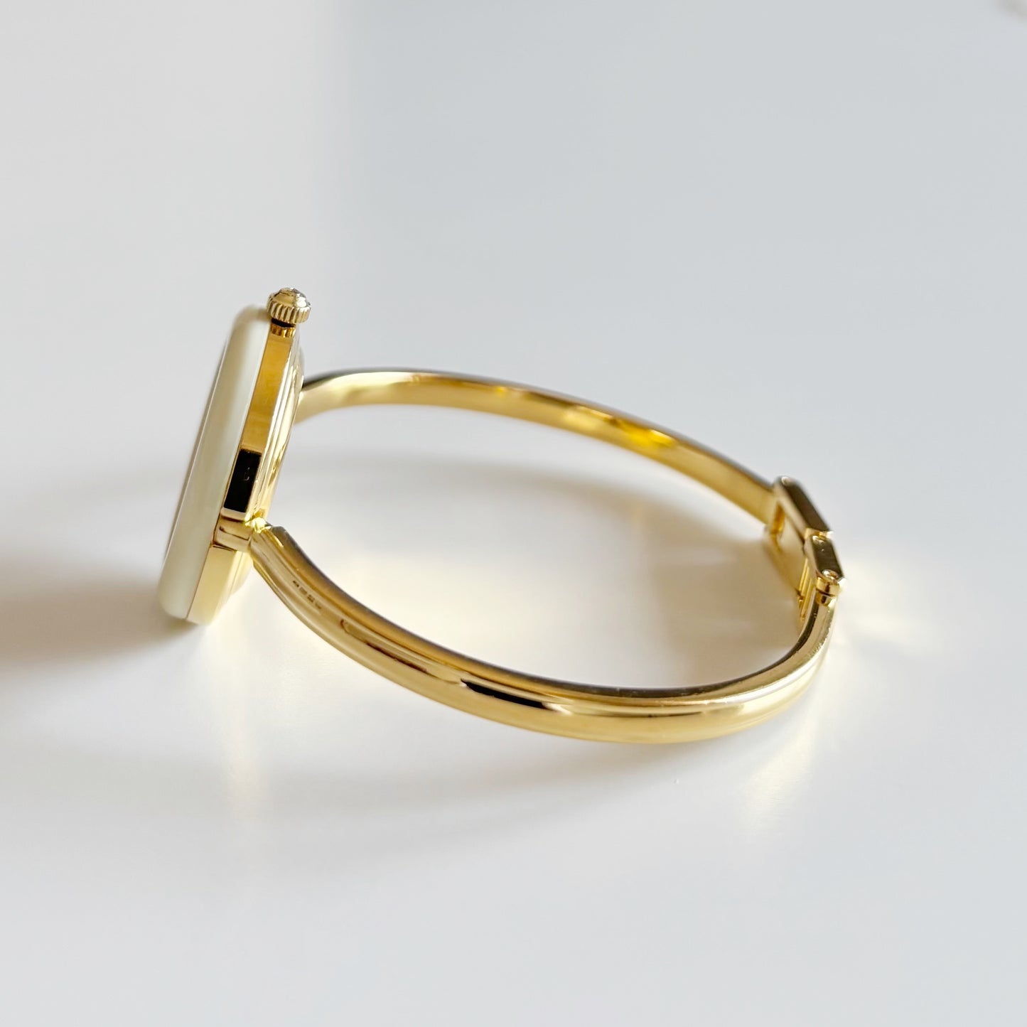 Gucci 1990s Interchangeable Bezel Gold Plated Bangle Watch with 12 bezels, case