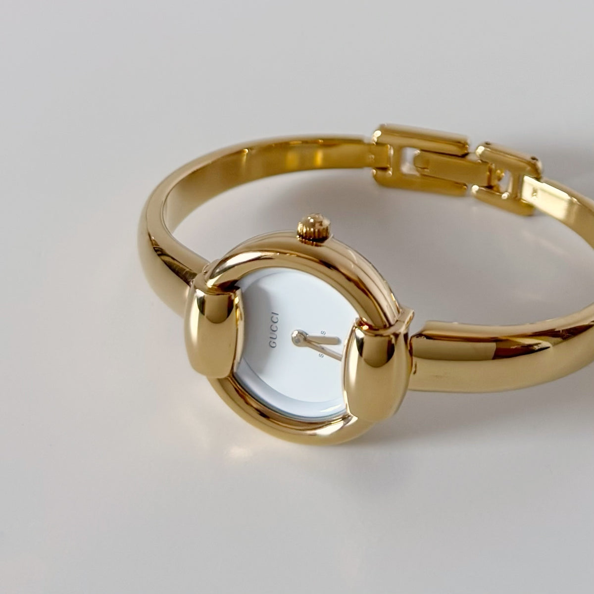 Gucci Round Dial Gold-Plated Bangle Watch
