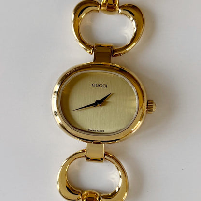 Gucci 1990s Oval Gold Dial Gold Plated Bangle Watch (Small)