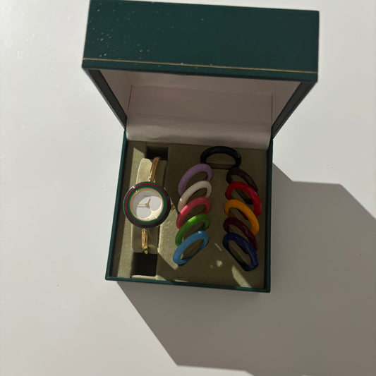 Gucci 1990s Interchangeable Bezel Gold Plated Bangle Watch with 12 bezels, case