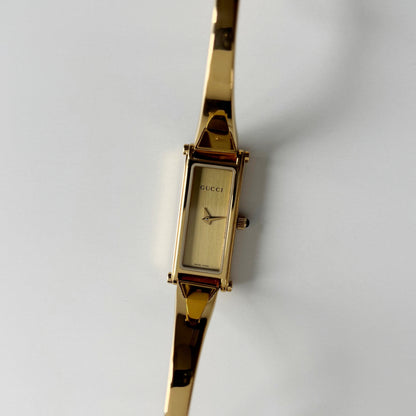 Gucci 1990s Gold Rectangular Dial Gold Plated Bangle Watch (Small)