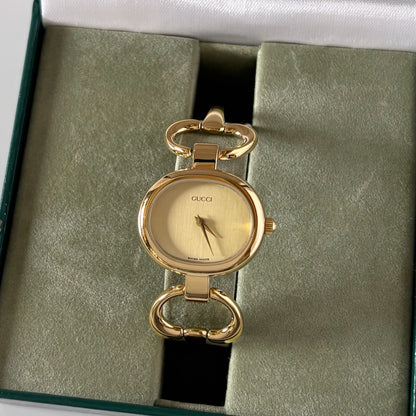 Gucci 1990s Oval Gold Dial Gold Plated Bangle Watch (Small)