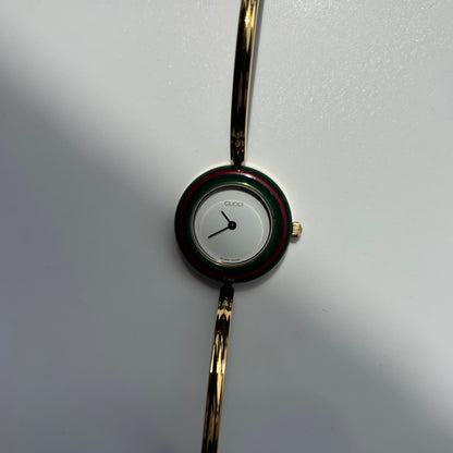 Gucci 1990s Interchangeable Bezel Gold Plated Bangle Watch with 12 bezels, case