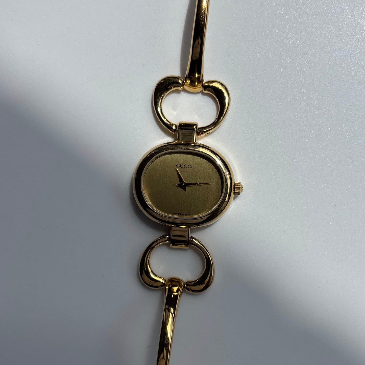 Gucci 1990s Oval Gold Dial Gold Plated Bangle Watch (Small)