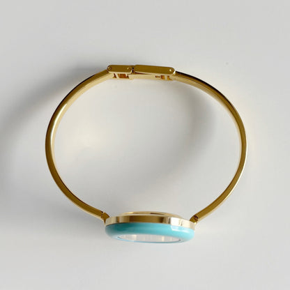 Gucci 1990s Interchangeable Bezel Gold Plated Bangle Watch with 12 bezels, case