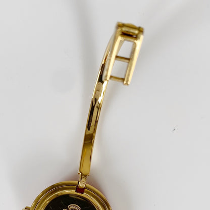 Gucci 1990s Interchangeable Bezel Gold Plated Bangle Watch with 12 bezels, case