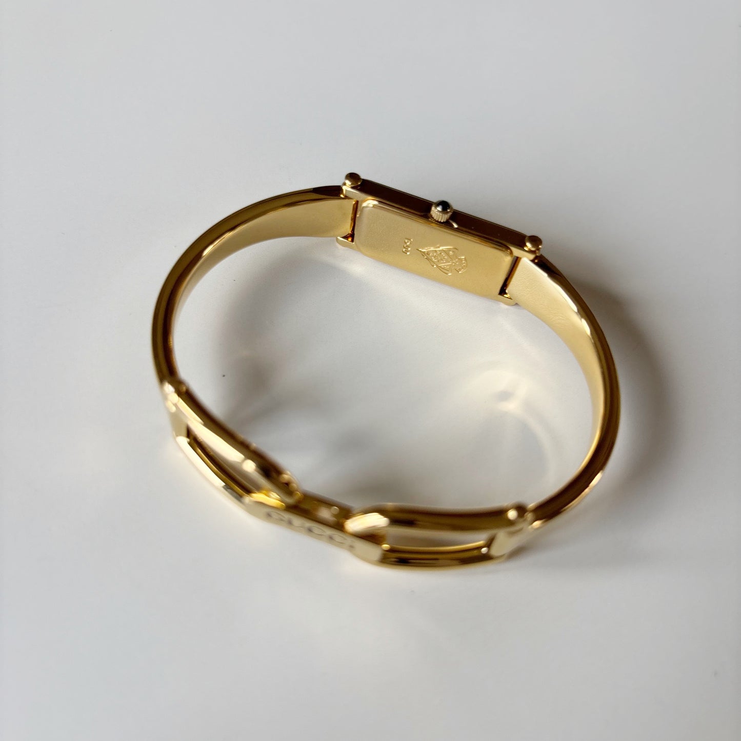 Gucci 1990s Black Rectangular Dial Gold Plated Bangle Watch