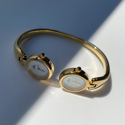 Fendi 1990s Seashell Dial Two Time Zone Gold Plated Bangle Watch