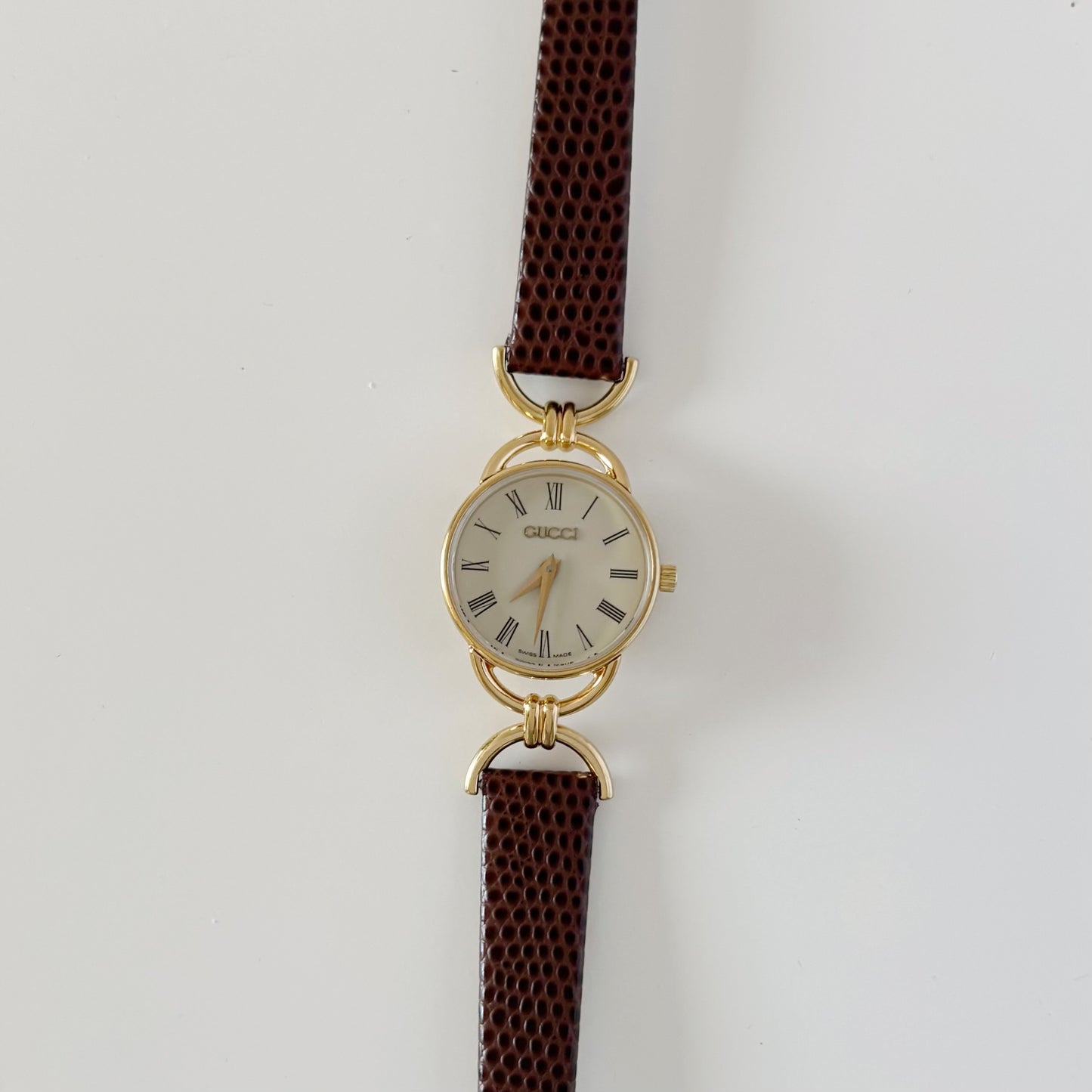 Gucci 1990s Round Cream Dial Horsebit Gold Plated Watch