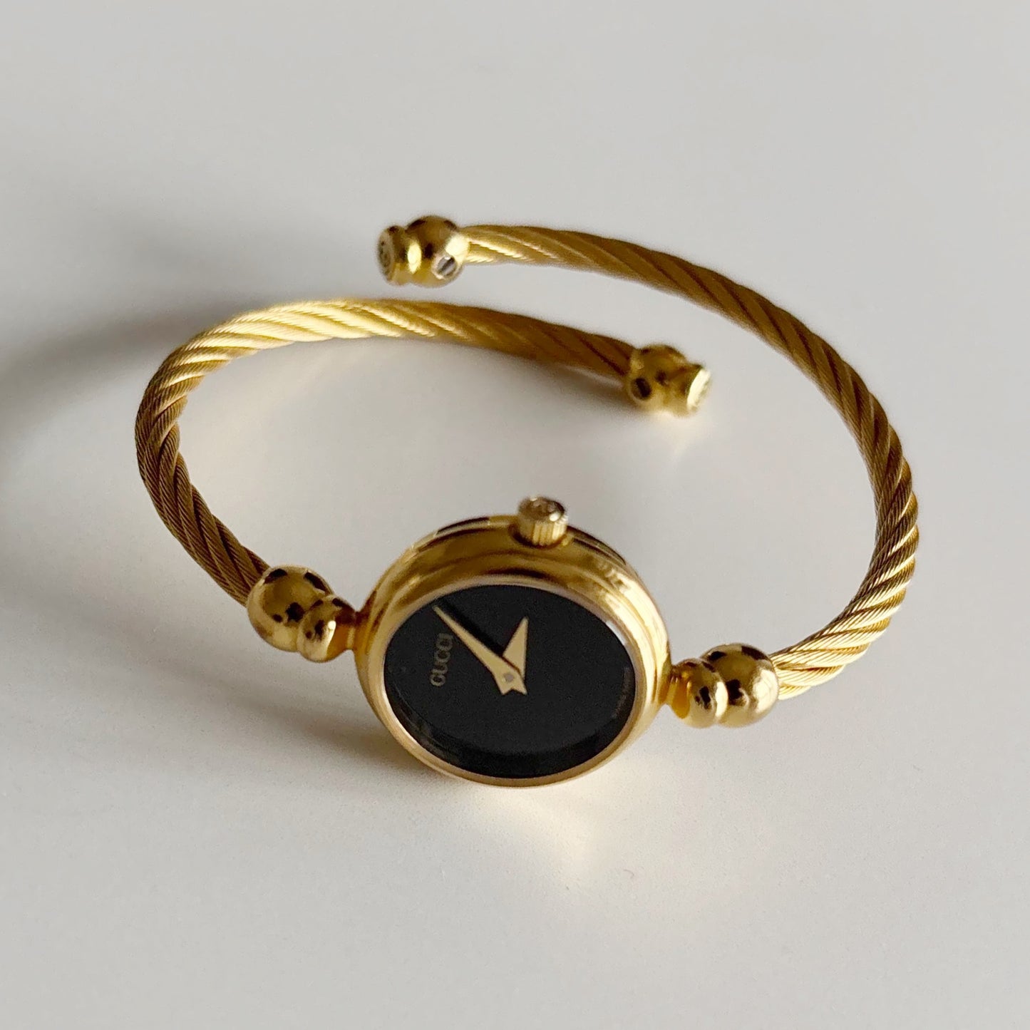 Gucci 1990s Black Dial Gold Plated Cable Bangle Watch
