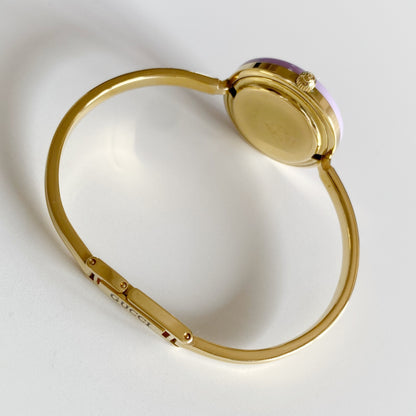 Gucci 1990s Interchangeable Bezel Gold Plated Bangle Watch with 12 bezels, case