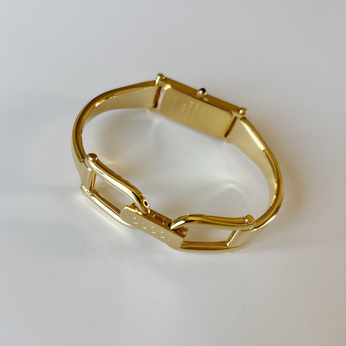 Gucci 1990s Rectangular Gold Dial Gold-Plated Watch