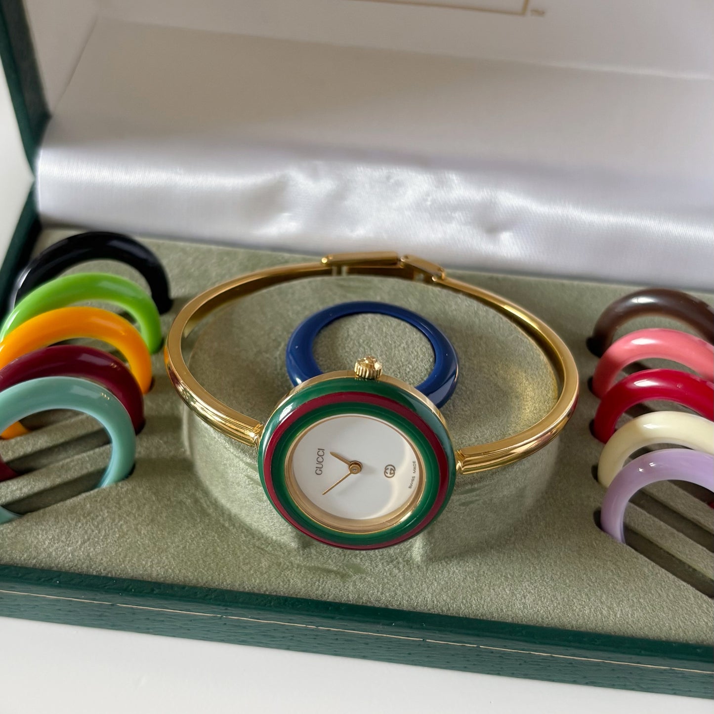 Gucci 1990s Interchangeable Bezel Gold Plated Bangle Watch with 12 bezels, case