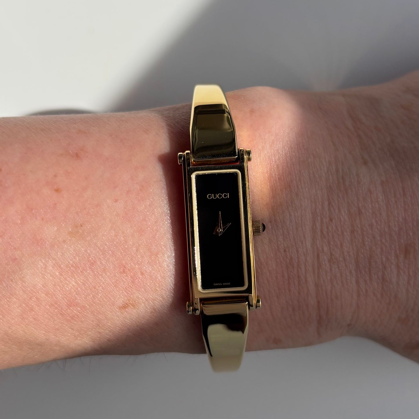 Gucci 1990s Rectangular Black Dial Gold Plated Bangle Watch