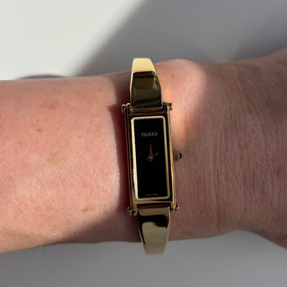 Gucci 1990s Rectangular Black Dial Gold Plated Bangle Watch