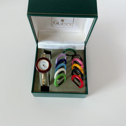Gucci 1990s Interchangeable Bezel Gold Plated Bangle Watch with 12 bezels, case
