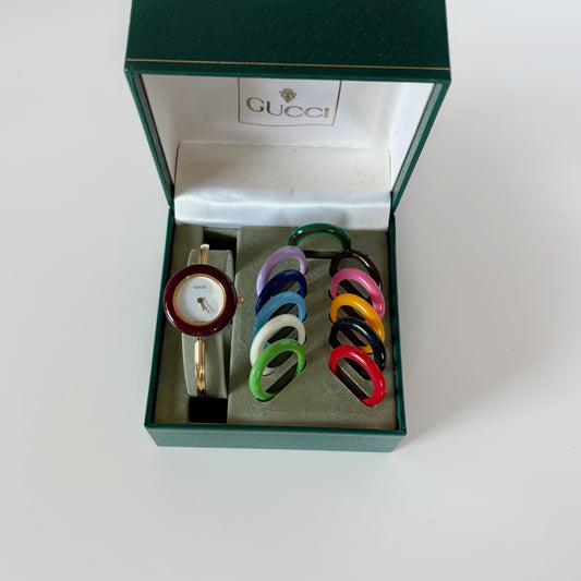 Gucci 1990s Interchangeable Bezel Gold Plated Bangle Watch with 12 bezels, case