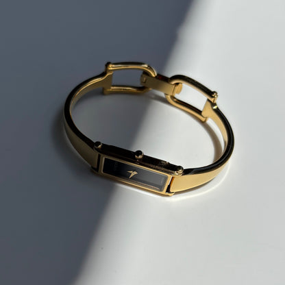 Gucci 1990s Black Rectangular Dial Gold Plated Bangle Watch