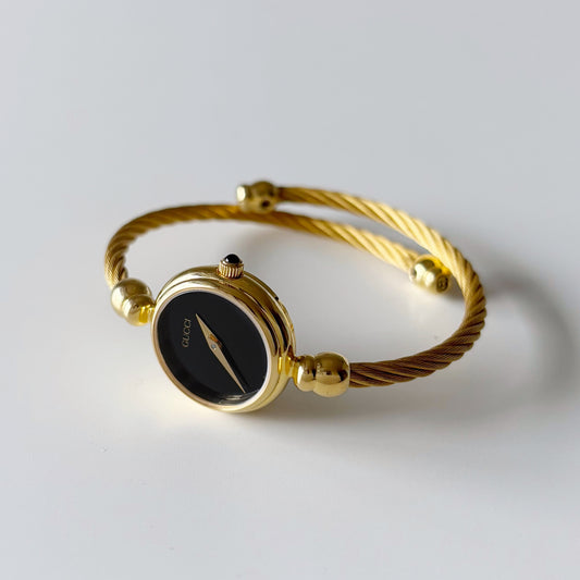 Gucci 1990s Black Dial Gold Plated Bangle Watch
