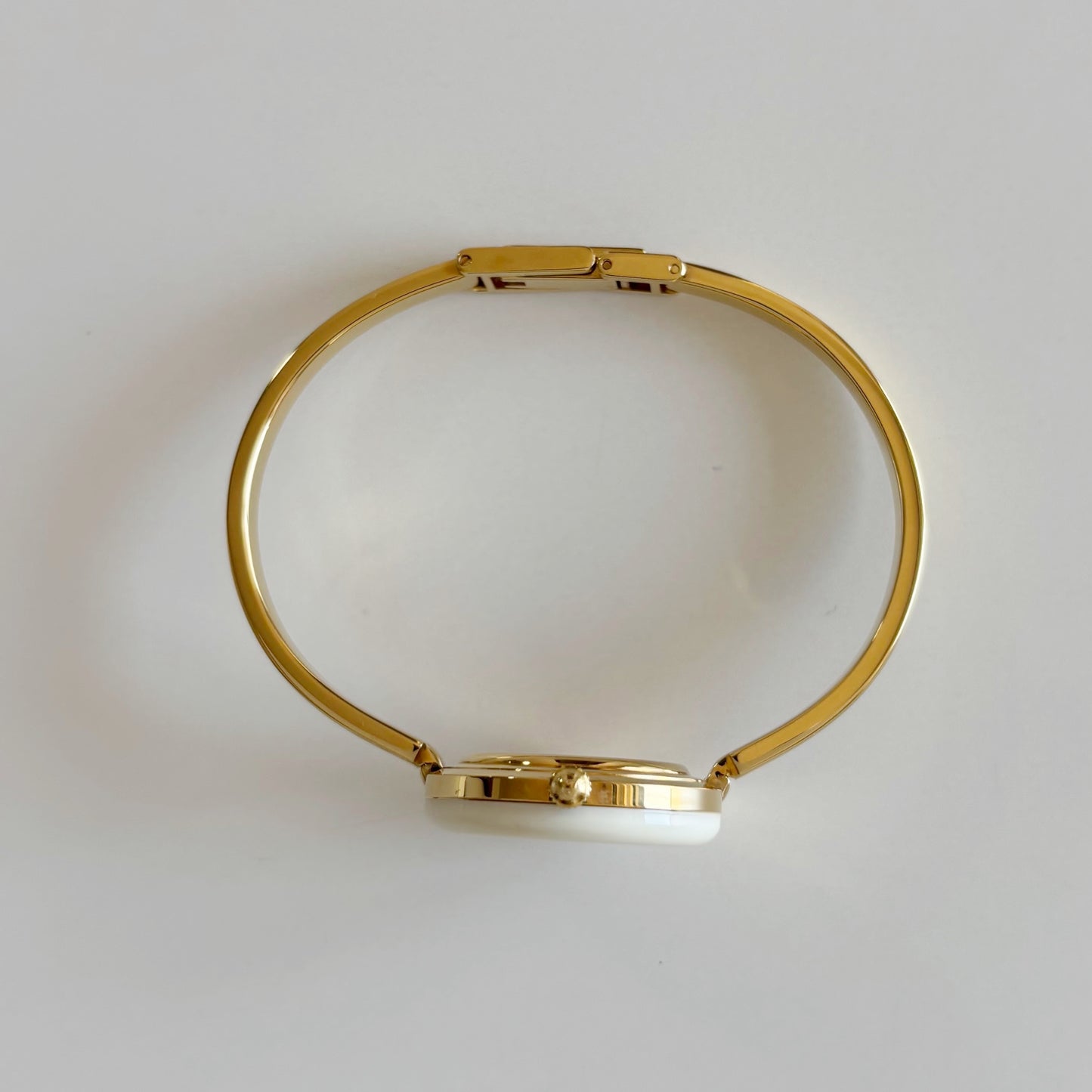 Gucci 1980s Interchangeable Bezel Gold Plated Bangle Watch with 12 bezels, case