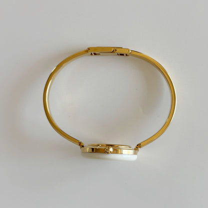 Gucci 1980s Interchangeable Bezel Gold Plated Bangle Watch with 12 bezels, case