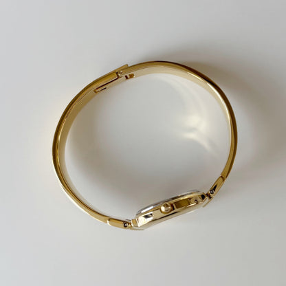 Givenchy 1990s Black Round Dial Gold Plated Bangle Watch