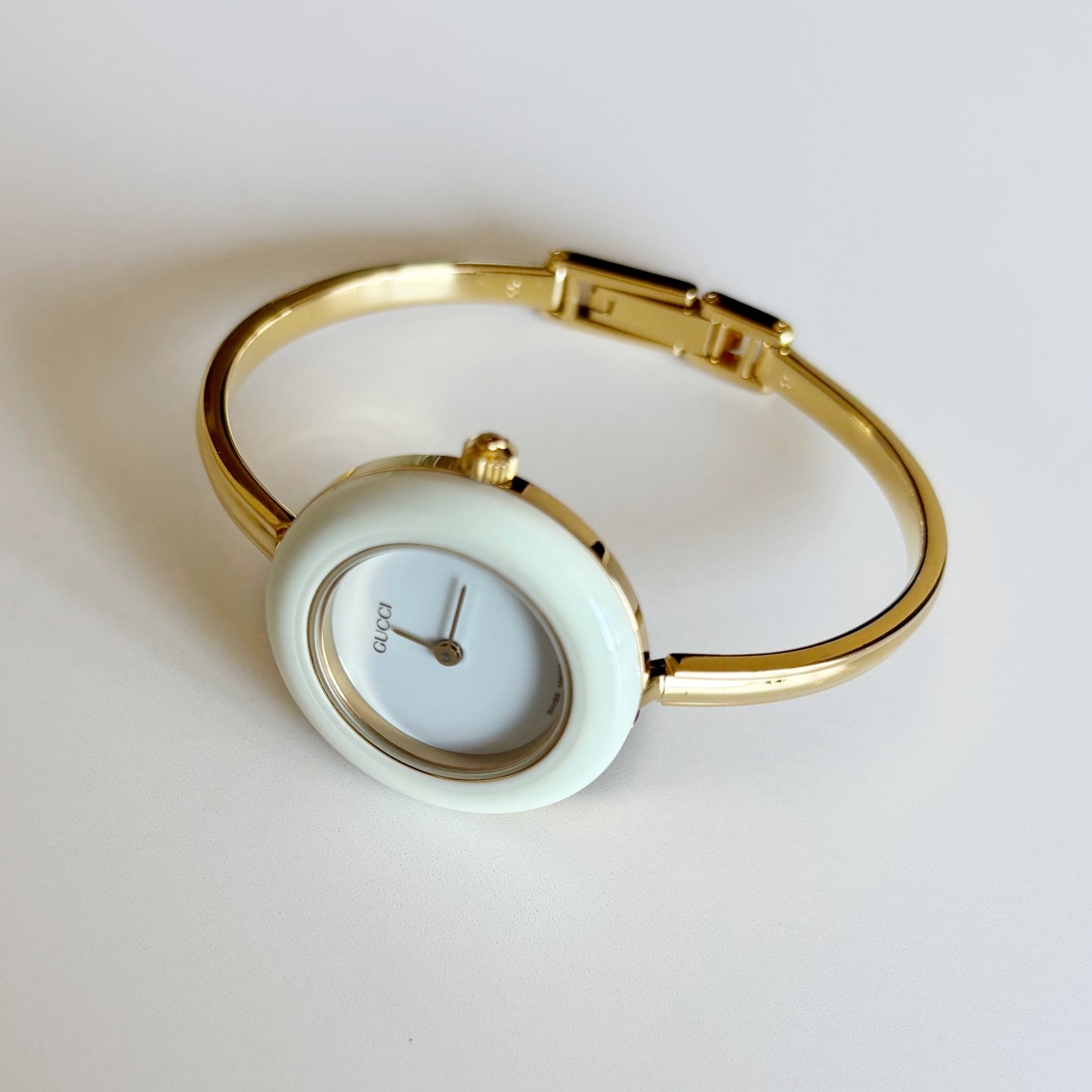 Gucci 1990s Interchangeable Bezel Gold Plated Bangle Watch with 12 bezels, case (Small)