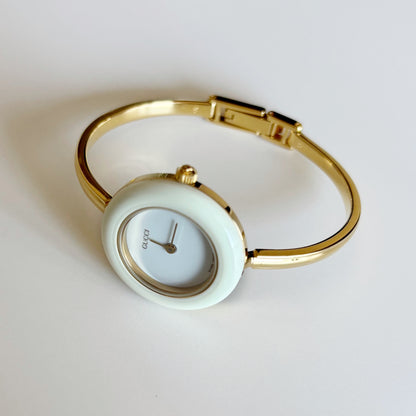 Gucci 1990s Interchangeable Bezel Gold Plated Bangle Watch with 12 bezels, case (Small)