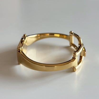 Gucci 1990s Rectangular Gold Dial Gold Plated Bangle Watch