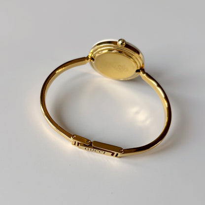 Gucci 1990s Interchangeable Bezel Gold Plated Bangle Watch with case, 12 bezels (Small)